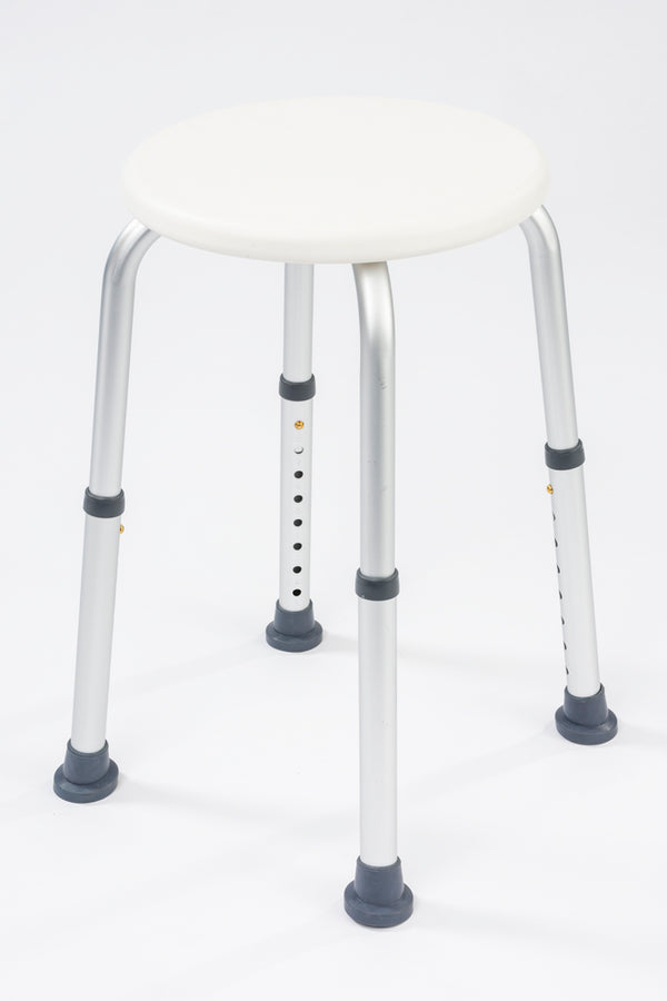 This image shows the shower stool, with white circular seat and silver legs, against a white background. 