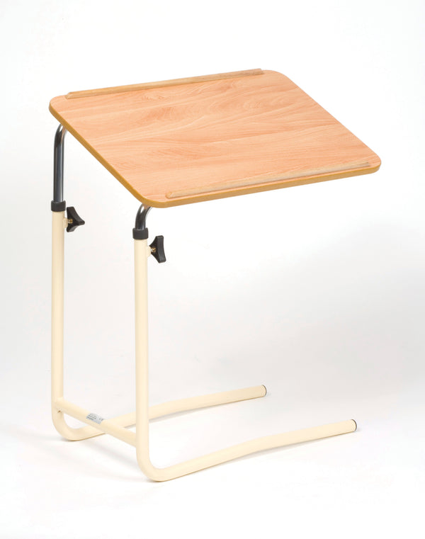 Image shows a brown desk with cream and silver frame, without wheels. This is shown against a white background.