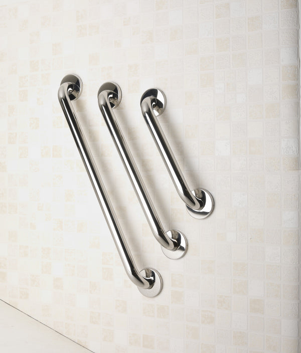 All three sizes of the curved steel grab rail on a cream bathroom wall.