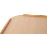 Image is a close up of the edge of the products, showing it has rounded corners and raised edges to keep items in place. Against a white background.