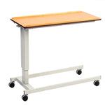 Image shows a brown table with wheeled grey frame on a white background. The table top has ridged long edges to prevent items from falling off. The white frame has four black wheels. 