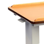 This image is a close up demonstrated the curved edges of the table and the raised edge on the long sides, designed to help keep items in place.