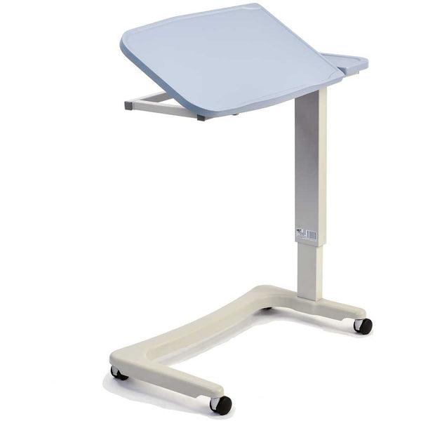 Image shows the pale blue over bed desk demonstrating how it can tilt. The product has one cream leg that is attached to a wheel frame with four black wheels.  